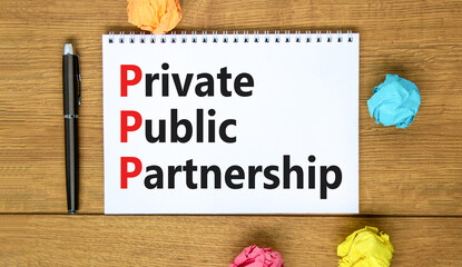 PPP private public partnership symbol. Concept words PPP private public partnership on white note on beautiful wooden background. Business PPP private public partnership concept. Copy space