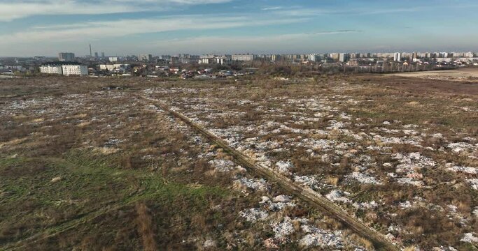 Garbage dump. City of Bucharest on hte background. Enviroment pollution concerns
