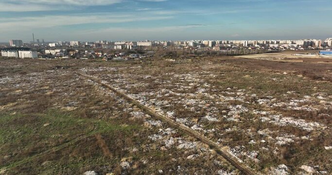 Garbage dump. City of Bucharest on hte background. Enviroment pollution concerns