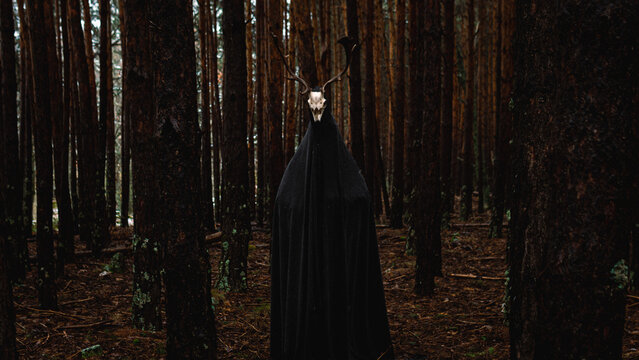 deer-headed spirit in a forest, in winter