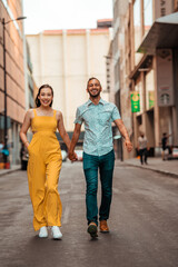 beautiful couple walking while holding hands