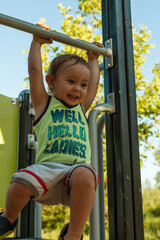 Fototapeta premium a small child is playing on the playground
