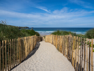 Pathway through the sand dunes to Fistral Beach at Newquay in Cornwall.