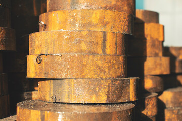 Steel round timber sawn into identical blanks for further metalworking, close-up