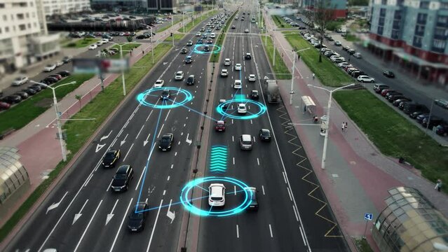 Visualization of the interaction of self-driving autonomous vehicles. Robotic cars are controlled by AI, driving along a busy city avenue, scanning the road with sensors, exchanging information. 