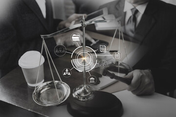 Business and lawyers discussing contract papers with brass scale on desk in office. Law, legal services, advice, justice and law concept picture with film grain effect