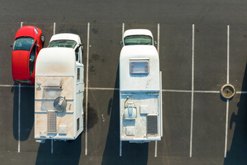 Aerial view of camper vans parked on parking lot