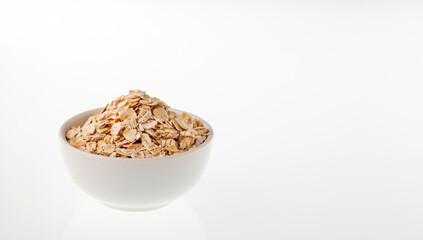 Avena sativa - Oat flakes in ceramic bowl