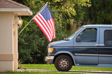 Classical americal van parked in front of a house. USA travel concept