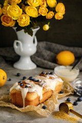 Cinnabon Rolls with blueberries and cream on a background with flowers