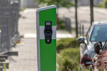 Electric cars charging at public charging station with renewable energy for electric vehicles and...
