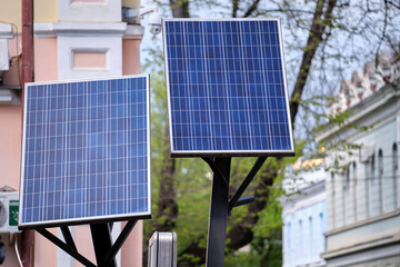 Solar photovoltaic panels mounted on city street pole for electricity supply of streetlights and...