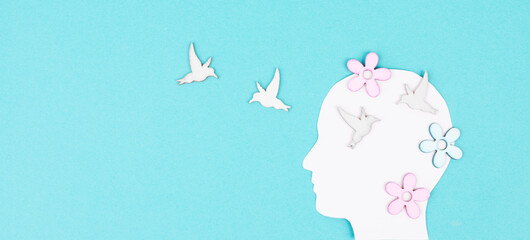 Silhouette of a woman with birds and flowers, greeting card with copy space, open mindset, creative portrait