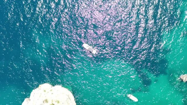 Aerial Drone Footage Directly Above a Boat in the Mediterranean Sea off the Coast of Capri, Italy
