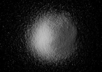 Kitchen salt crystals isolated on black, top view