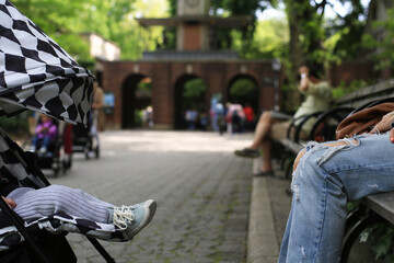 Baby in a stroller in front of his mother in Central Park New York