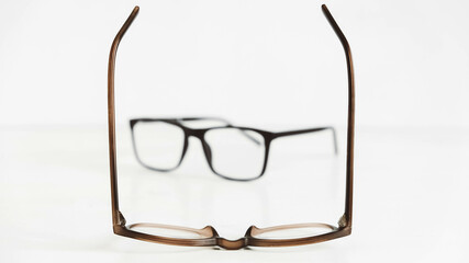 Optical glasses of different shapes on a white background