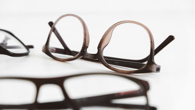Three optical glasses of different shapes on a white background