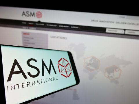 Stuttgart, Germany - 02-06-2022: Cellphone with logo of Dutch semiconductor company ASM International N.V. on screen in front of business website. Focus on left of phone display.