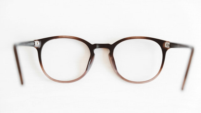Round optical glasses on a white background