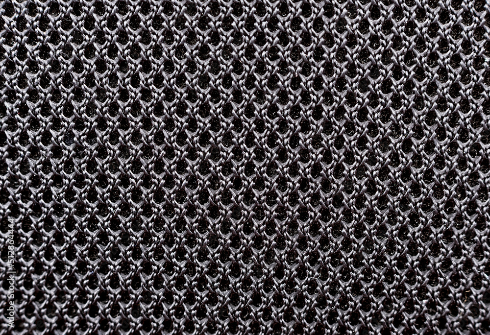 Poster texture of black material with mesh structure. background from fabric in with small circles