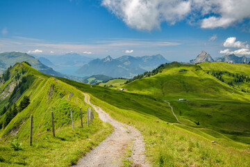 Naklejka na ściany i meble Walking trail on ridge in Swiss Alps