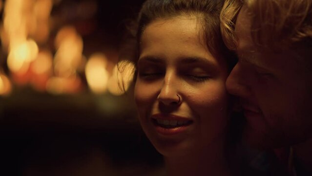 Closeup couple touch sensual on romantic night. Lovers kiss cheek face on date.
