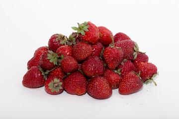 Strawberries on a white background. Strawberry close-up isolated. Juicy berries picked for dessert.