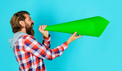 Protest. Bearded man shouting in paper loudspeaker. Own opinion. Freedom of speech. Worlds problems.