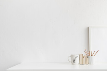 Home office, creative desk with office supplies and white wall. Bright and minimal workspace.