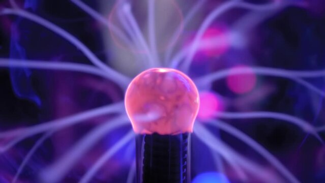 Close up view - plasma ball with many energy rays inside. Electricity, technology, education, science, futuristic and physics concept