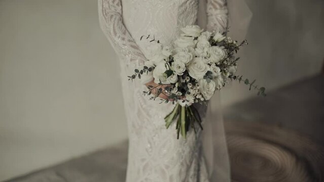 Bride's photo shoot. Luxurious wedding bouquet in a rustic style in the hands of the bride. Close-up.