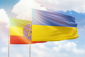 Sunny blue sky and flags of ukraine and ethiopia