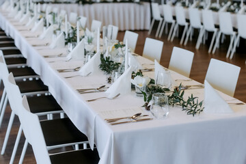 Banquet table. Decorating the table with flowers. Banquet table for a wedding.