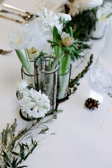 Banquet table.  Decorating the table with fresh flowers.