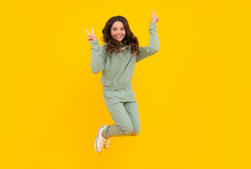 Sports studio portrait of teenager child wears sportswear. Teen girl is standing in sport outfit.