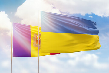 Sunny blue sky and flags of ukraine and andorra