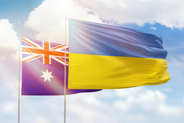 Sunny blue sky and flags of ukraine and australia