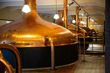 Copper beer tanks in modern brewhouse using traditional brewing technologies..
