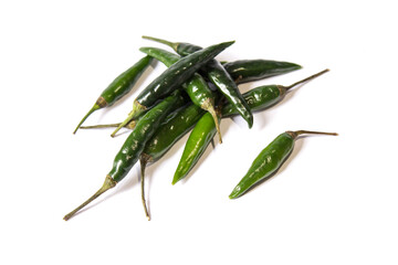 green chillies lie on a white background