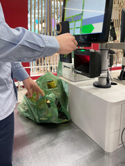 Customer pays his purchase at the supermarket,self checkout systems in  retail stores,Barcode...
