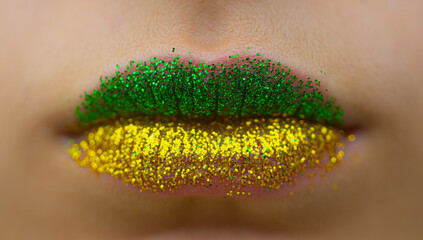 
Female mouth with shine of Brazilian colors (green and yellow)