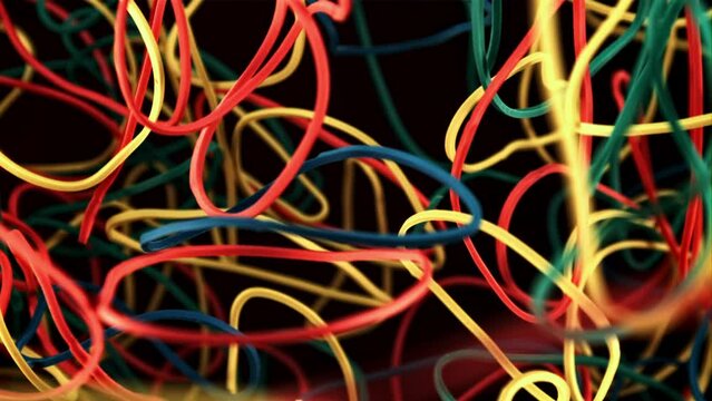 Multi colored rubber bands in flight. On a black background. Filmed on a high-speed camera at 1000 fps.
