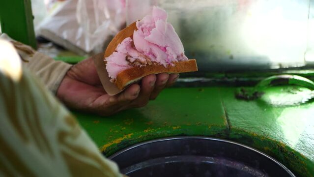 A traditional Indonesian ice cream seller serving customers. Es puter street vendors are serving buyers.