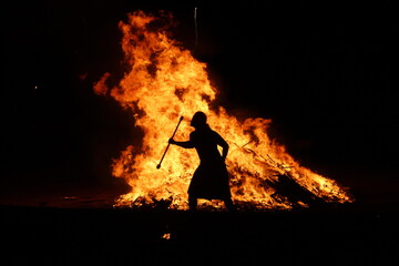 Silhouette of a man in a bonfire