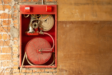 fire hose on the wall horizontal composition