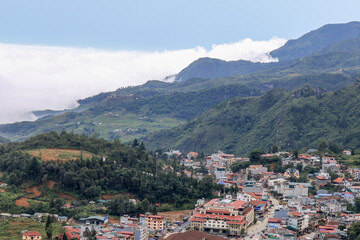 Naklejka na ściany i meble Lao Cai Province,north-west Vietnam on July 14,2019:Panorama View over Sapa Town from Mount Hamrong.