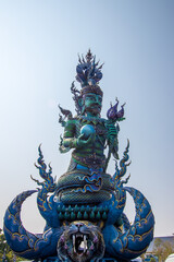 Fototapeta premium Chiang Rai Province,Northern Thailand on January 19,2020:Angellic Temple Guardians at the entrance pillars of Wat Rong Suea Ten or Blue Temple.