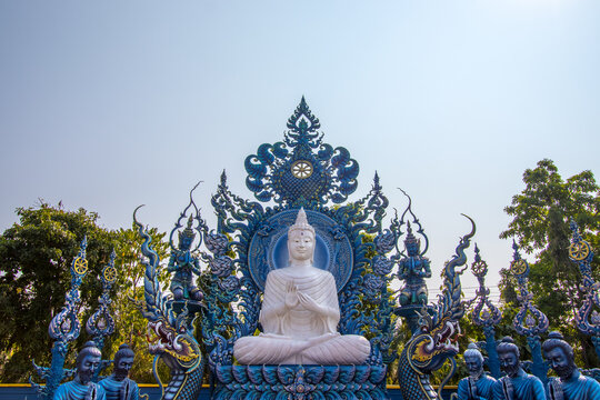 Chiang Rai Province,Northern Thailand on January 19,2020:White Buddha image and disciples of Lord Buddha at Wat Rong Suea Ten or Blue Temple.(selective focus)