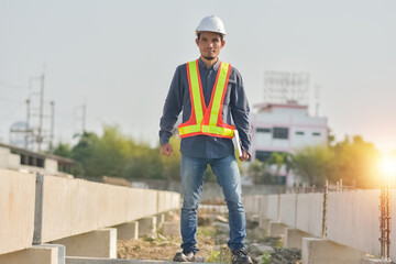 Asian man construction safety suit helmet onsite work, Asian man Engineer